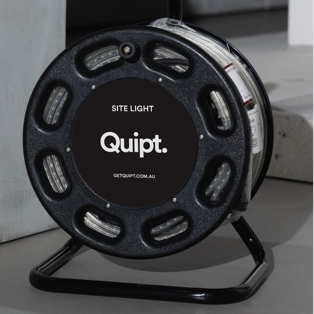 Black reel with 'Quipt.' branding and 'Site Light' text on a gray background - construction LED lighting on portable drum